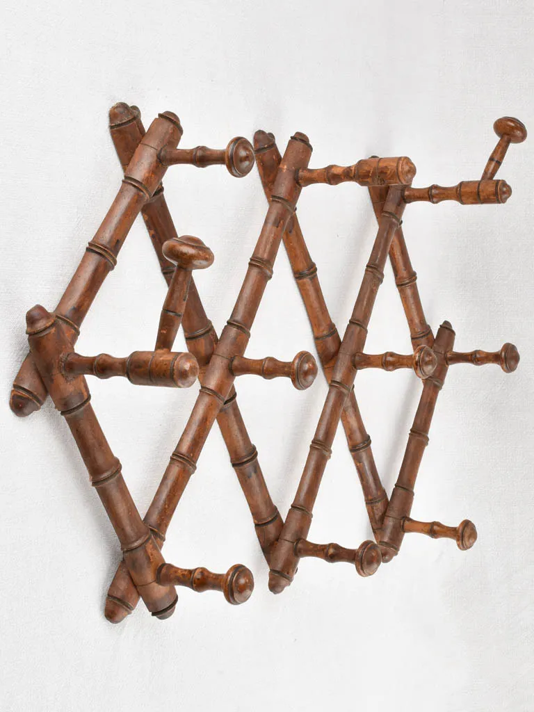 Antique concertina coat hooks 35½"