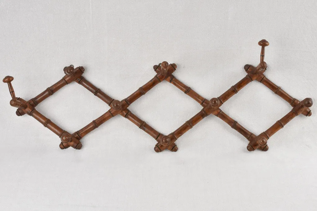 Antique concertina coat hooks 35½"