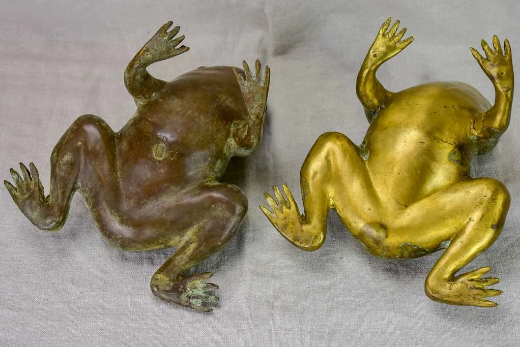 Pair of metal garden frog sculptures